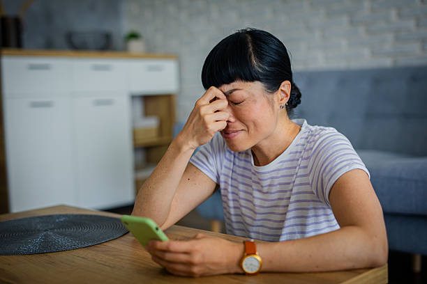 istock Lonely Woman Feeling Worried While Browsing Phone 2223536787