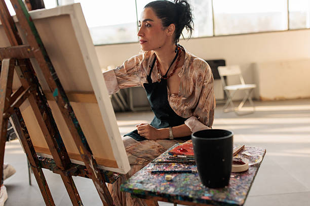 istock Beautiful Female Artist Creating Artwork 2223537381