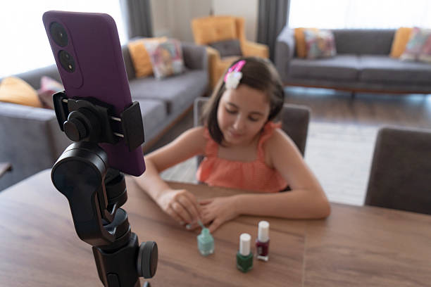 istock A talented young girl is showing cosmetic products while recording her make up tutorial 2223539137