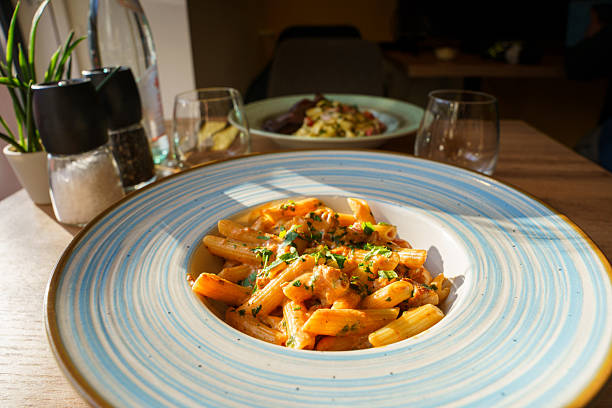 istock Creamy penne pasta with sausage and herbs 2223539582
