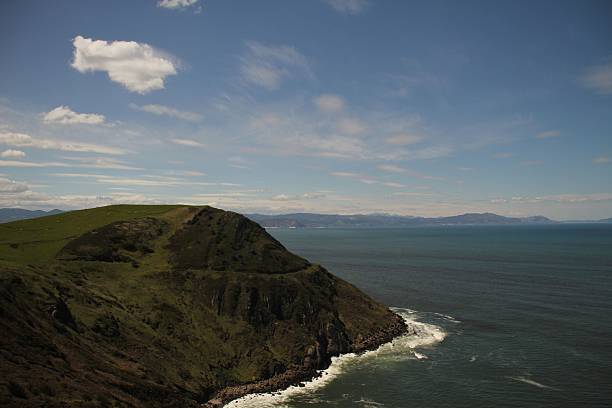 istock Scenic coastal view with grassy cliffside and ocean. 2223540010