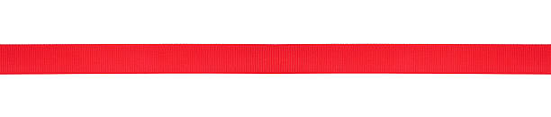 istock Single red horizontal ribbon isolated on a white background. Red satin ribbon. 2223541209