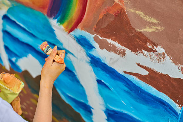 Vibrant painting creation with waterfall and rainbow elements