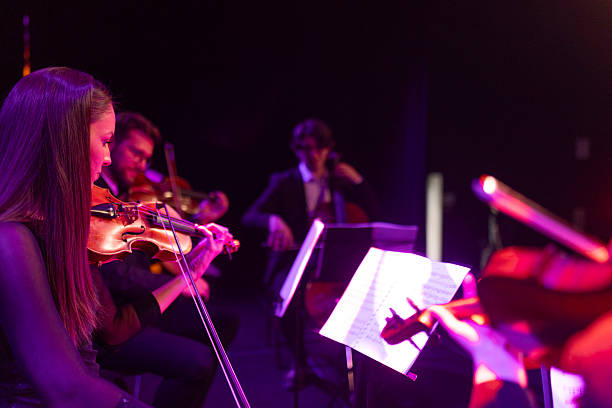 istock A string quartet performs a classical music concert in front of an audience on a theater stage 2223543347