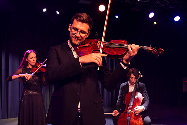 istock A string quartet concert led by a talented and confident male violinist 2223543391