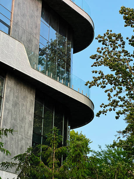 istock Modern architectural building surrounded by lush green trees on a sunny day 2223550247
