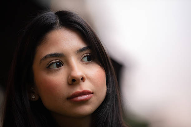 Portrait of young woman, Black and long haired.