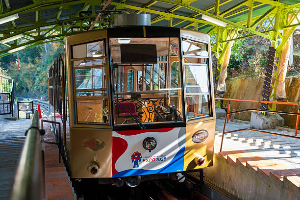 Otsu, Shiga, Japan - November 21 2024 : The retro Sakamoto Cable funicular with official EXPO 2025 Osaka, Kansai logo livery at the historic station.