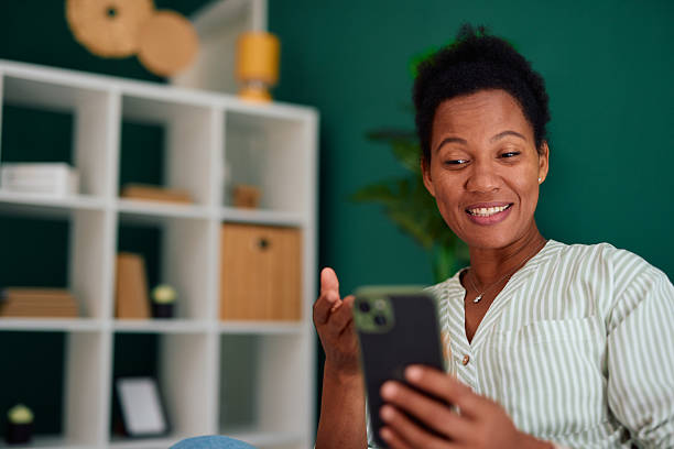 istock Smiling woman having a video call at home 2223554602