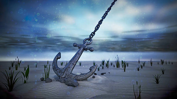 istock Rusty anchor resting on sandy ocean floor with aquatic plants swaying gently in the current at twilight 2223557088