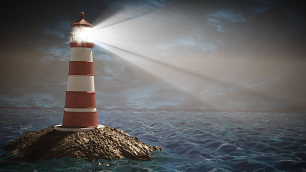 istock Lighthouse standing on rocky island guiding ships under a dramatic cloudy sky 2223557191