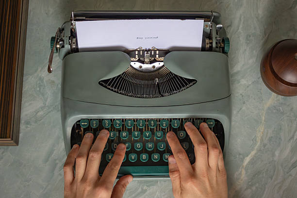 istock Writer typing stay positive on vintage typewriter 2223560157