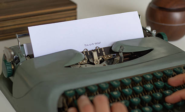 istock Writer typing you got this motivational message on vintage typewriter 2223560345