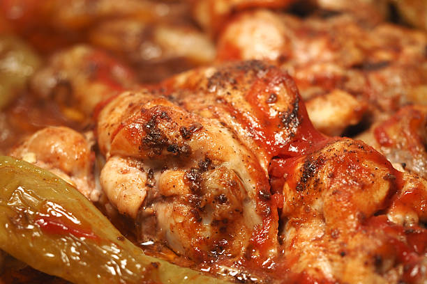 Tender chicken cooked in a rich sauce with green peppers and spices.