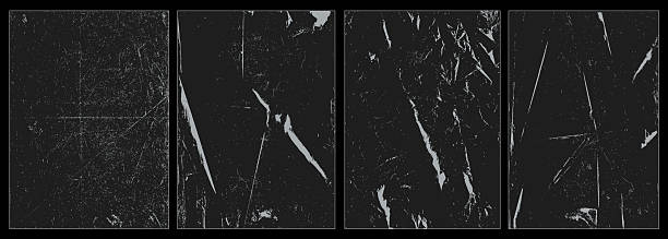 istock Vintage overlay textures with folded paper look, distressed scratches, dusty grunge marks, torn edges, and punk style creases. Ideal for damaged film frames, retro effects, or raw design. Vector. 2223562187