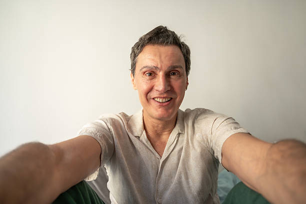istock Happy mature man taking a selfie with a big smile 2223563036