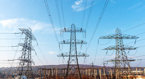 istock Tall power lines dominate the landscape under clear blue sky showing infrastructure that supports everyday life and energy supply 2223564631