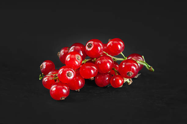 istock Red berries. Red currant. Bunch of red berries on dark background. Selective focus 2223565039