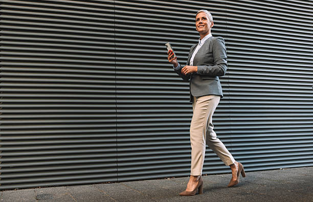 istock Smiling Businesswoman Walking with Purpose 2223567546