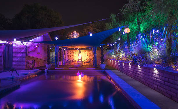 istock Colorful Mid-Century Pool Patio with Fireworks and Ambient Lighting 2223569832