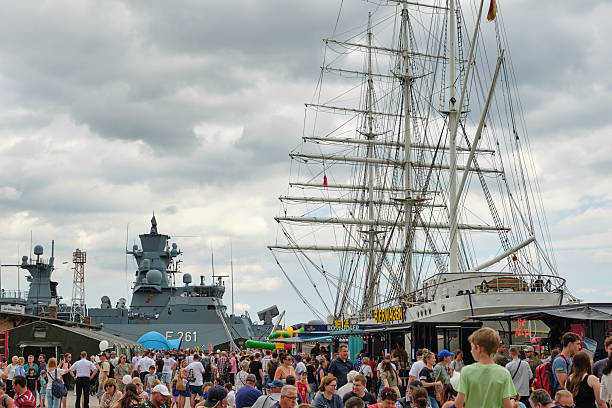 June 30, 2025 â Stralsund, Germany: Crowds pack the historic harbor on Bundeswehr Day, with the threemasted bark Gorch Fock I, beer trucks, and German corvette Magdeburg (F261).