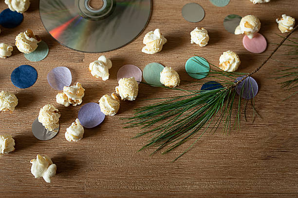 Popcorn, colorful confetti and CD for a cozy TV evening