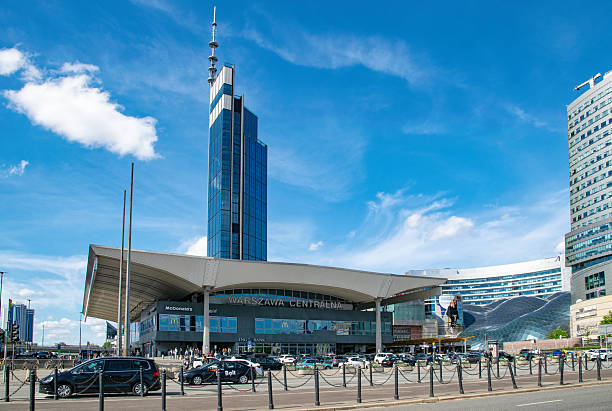 Warsaw, Poland - April 20, 2025: Modern building of the Central Railway Station and the downtown cityscape in Warsaw. Business and transportation in Europe