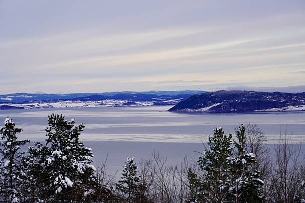 A view of the calm surface of the Stjoerdalsfjord, a part of the Trondheimsfjord, an early winter morning.