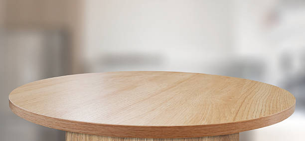 istock Close-up of an empty round table, for product display, with a blurred kitchen in the background 2223590205