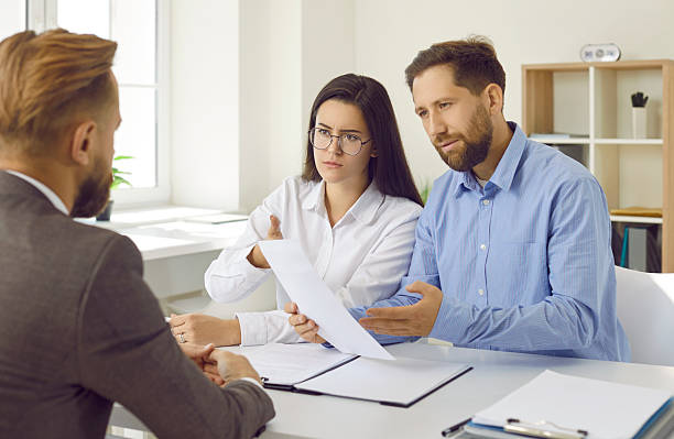 istock Angry clients having misunderstanding while talking about business contract with manager 2223591386