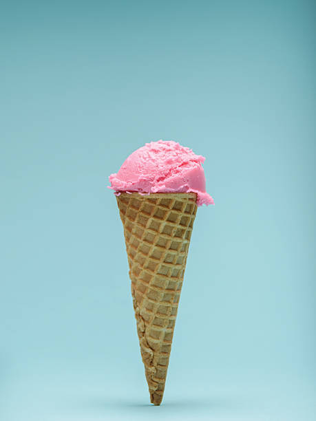 istock Pink Ice Cream cone isolated on blue background 2223592828