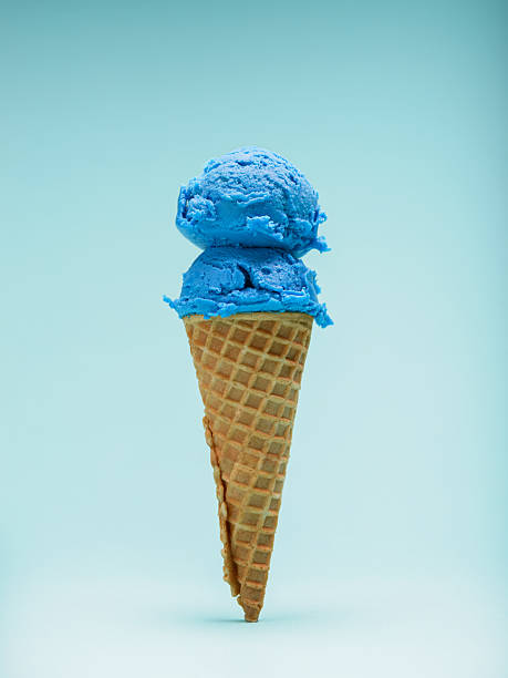 istock Double scoop blue bubble gum ice cream cone isolated on blue background 2223592848