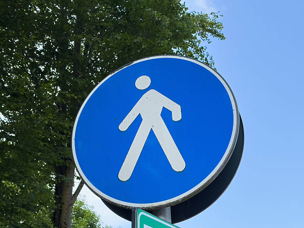 istock Blue pedestrian traffic sign against clear sky background 2223592896