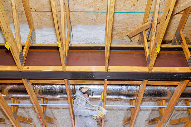 istock Construction worker applying spray foam insulation in home renovation project during thermal barrier 2223595831