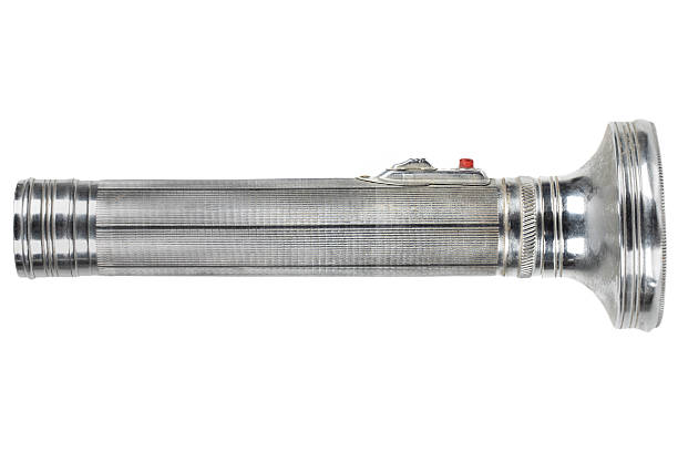 retro vintage battery powered flashlight isolated on white background