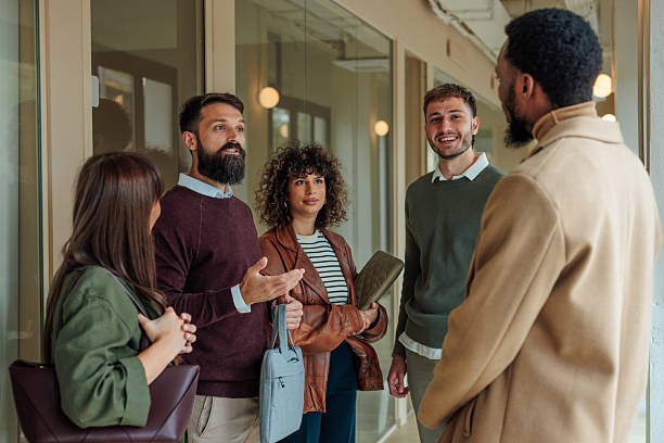 istock Business team having a conversation in the office hallway 2223610592