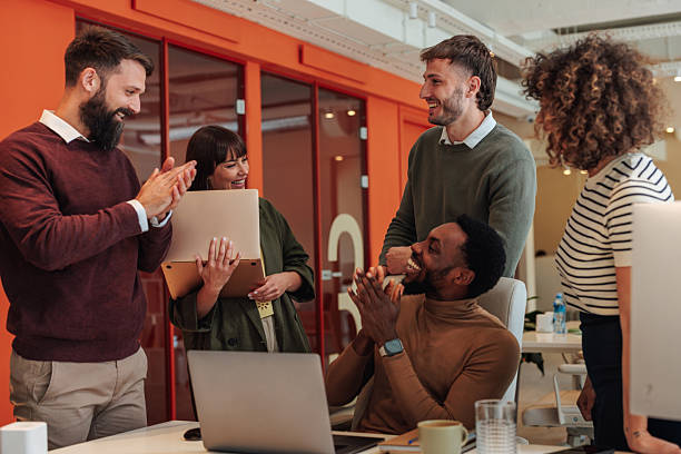 istock Startup Team Celebrating Success in Modern Office 2223610605