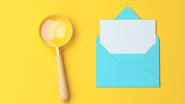 istock Envelope and magnifying glass on yellow background email search concept illustration 2223611475