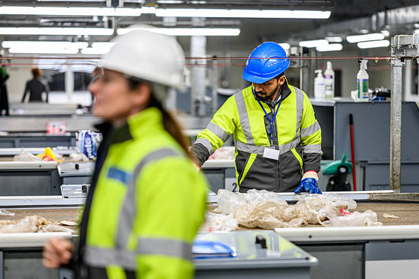 istock Workers in Safety Gear at Industrial Facility 2223613891