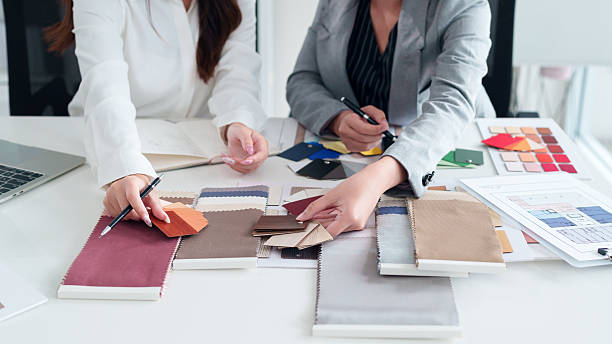 istock Interior Designer Team Brainstorming Color Palette and Material Samples for Home Renovation Project and Creative Design Studio Workplace Meeting 2223614358