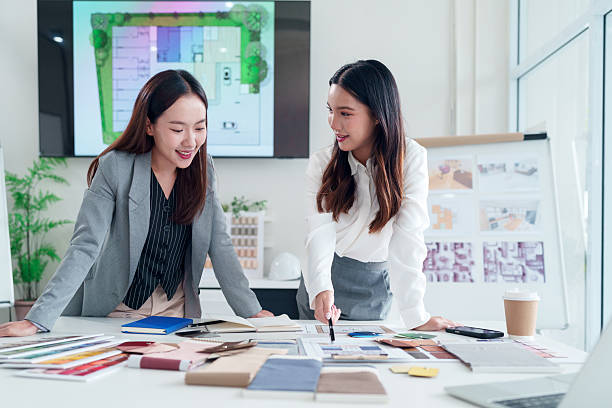istock Asian Interior Designers Teamwork on Project Plan in Office for Modern Home Design Renovation Collaboration and Creative Solutions to Make Dream Home with Expertise 2223614400