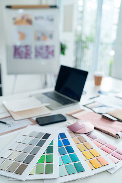 istock Interior Design Color Palette Swatches for Home Decor Selection Architect Workspace for Choosing Color Schemes Paint Samples with Laptop on Table 2223614436