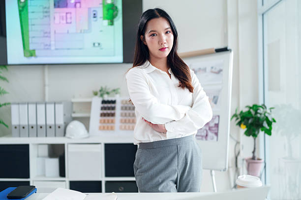 istock Asian Architect Woman Portrait: Professional Design Studio with Floor Plans, Interior Ideas, Modern Office Space, and Creative Architectural Concepts 2223614470