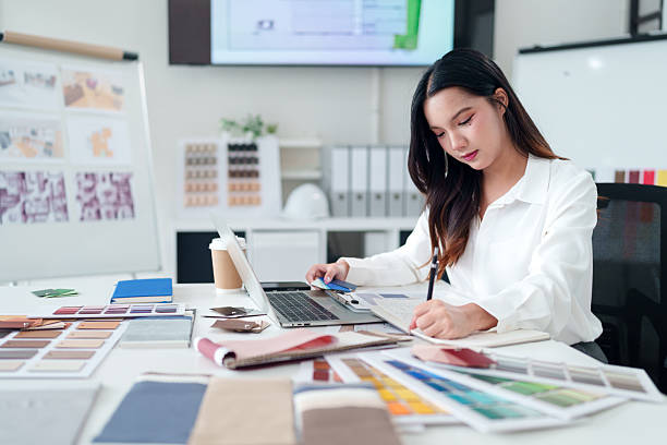 istock Asian Interior Designer at Work Selecting Color Palette for Home Renovation Project | Architect Choosing Materials | Design Studio Workspace Inspiration 2223618112