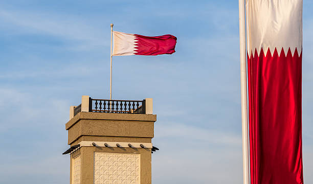 istock qatar flag flying high in the wind. 2223621258