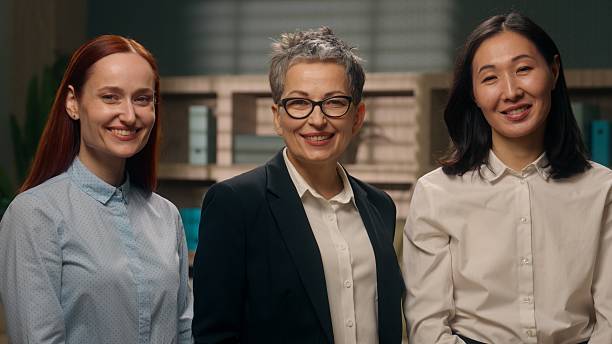 istock Multinational women office portrait looking at camera smiling successful coworkers workers ladies females indoor businesspeople business professional team financial company leader employees together 2223624336