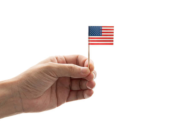 Point hand sign. Point gesture with pointed index finger. Hand covered by us american flag.