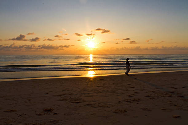 istock Woman relax with sunrise and silhouette 2223627023
