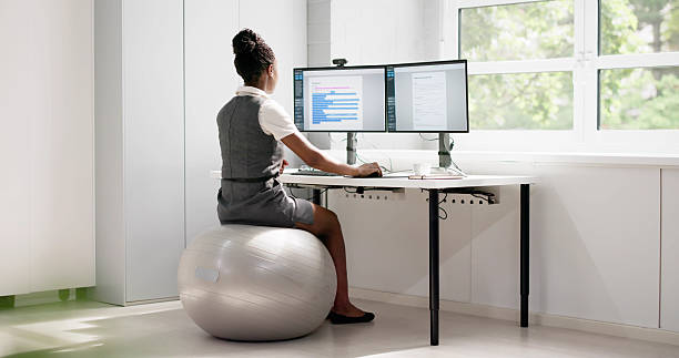 istock Corporate African American Woman Working On Exercise Ball 2223628232