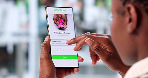 istock Young Woman Using Smartphone To Donate Money 2223628417